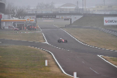 Lewis Hamilton drives a Ferrari F1 car around the Fiorano circuit as part of the TPC tests