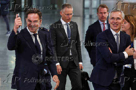 Dutch Prime Minister Mark Rutte and NATO Secretary-General Jens Stoltenberg walk in Brussels