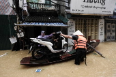 Red River overflows causing severe flooding in Hanoi following Typhoon Yagi