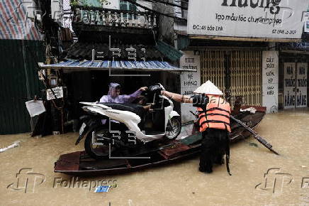 Red River overflows causing severe flooding in Hanoi following Typhoon Yagi