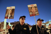 Hostages' families participate in lighting of first Hanukkah candle at Western Wall in Jerusalem