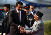 Nepal's President Ram Chandra Poudel greets Qatar's Emir Sheikh Tamim Bin Hamad Al Thani in Kathmandu