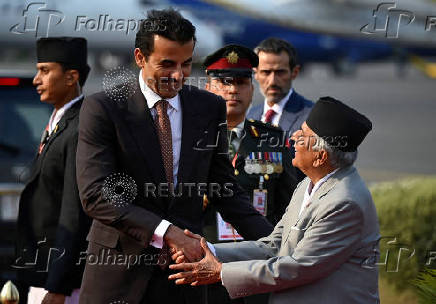 Nepal's President Ram Chandra Poudel greets Qatar's Emir Sheikh Tamim Bin Hamad Al Thani in Kathmandu