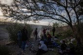 Migrants camp along Rio Grande river while searching for entry into the United States