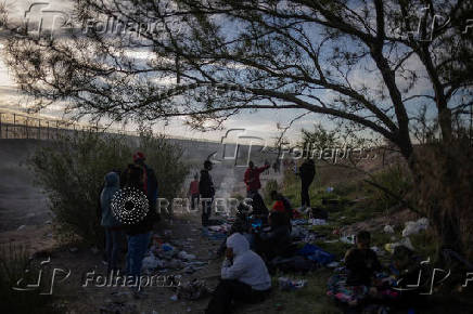 Migrants camp along Rio Grande river while searching for entry into the United States