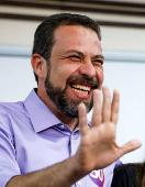 Sao Paulo mayor candidate leftist Guilherme Boulos gestures while voting at a polling station during the municipal elections in Sao Paulo