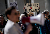 Demonstrators rally in support of U.S.Department of Education outside its building in Washington