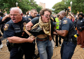 University of Texas Police detain a man at a pro-Palestinian protest at the University of Texas