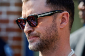 Singer Justin Timberlake waits to address the media after his appearance in court in Sag Harbor, New York