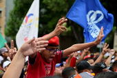 Government supporters participate in a march in support of Venezuelan President Nicolas Maduro's victory in the July 28 elections, in Caracas