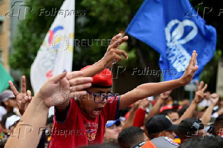 Government supporters participate in a march in support of Venezuelan President Nicolas Maduro's victory in the July 28 elections, in Caracas