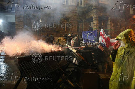 Georgian opposition supporters protest against government's EU application delay, in Tbilisi