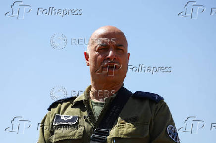 Military reservist Brigadier General Doron Gavish speaks during a press briefing, near Ashkelon