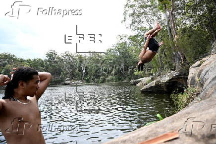 People cool off at Lake Parramatta, near Sydney