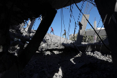 Aftermath of an Israeli strike on a house, in Deir Al-Balah in the central Gaza Strip