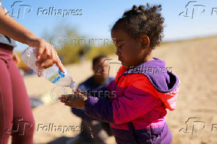 Migrants seeking asylum in the United States gather on the banks of the Rio Bravo river in Ciudad Juarez