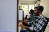Officials work at a call center ahead of India's general election at the Office of the Chief Electoral Officer, Bengaluru