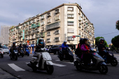 People ride motorbikes in Taipei