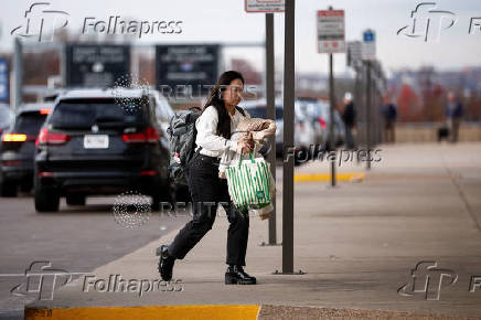 Travelers at Ronald Reagan National Airport (DCA) ahead of the Thanksgiving holiday in Arlington