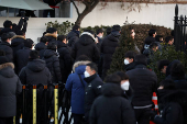 Members of the Corruption Investigation Office for High-ranking Officials gather in front of the impeached South Korean President Yoon Suk Yeol's official residence