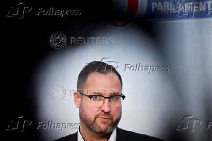 Far-right Freedom Party's co-Secretary-General Christian Hafenecker speaks to reporters