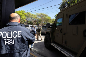 Agents with Homeland Security Investigations (HSI) conduct a search for undocumented migrants in San Juan