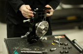FILE PHOTO: A worker assembles a part of the chassis for a BAC Mono car at the company's factory in Liverpool