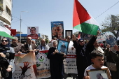 Palestinians rally to mark Prisoners' Day, in the West Bank city of Nablus