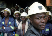 FILE PHOTO: Konkola Copper Mines PLC workers wait in a lift before going to work underground in Konkola