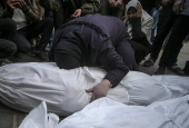 Palestinians mourn their dead at Deir Al Balah hospital after Israeli airstrike in central Gaza