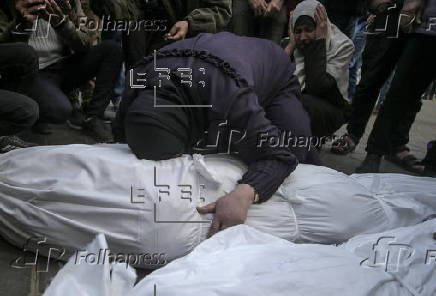 Palestinians mourn their dead at Deir Al Balah hospital after Israeli airstrike in central Gaza