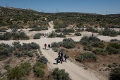FILE PHOTO: Asylum-seeking migrants enter the United States from Mexico in Jacumba Hot Springs