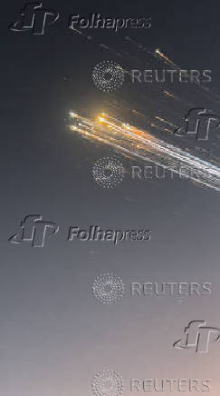 Orange balls of light fly across the sky as debris from a SpaceX rocket launched in Texas is spotted over Turks and Caicos Islands