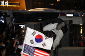 Pro-Yoon protesters participate in a rally outside a court, in Seoul