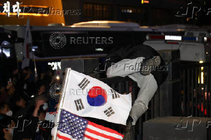 Pro-Yoon protesters participate in a rally outside a court, in Seoul