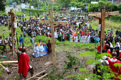 Indonesian Catholics perform a re-enactment of the crucifixion of Jesus Christ during Good Friday in Manokwari