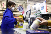 FILE PHOTO: Customers shop in a Carrefour hypermarket in Paris