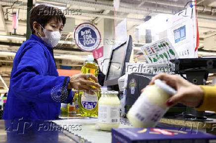 FILE PHOTO: Customers shop in a Carrefour hypermarket in Paris