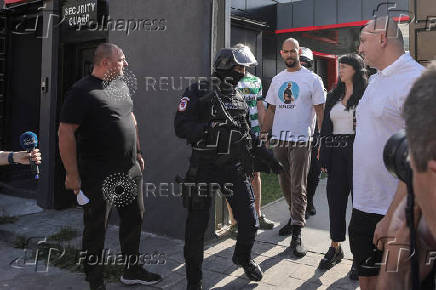 FILE PHOTO: Romanian Gendarmes escort Andrew and Tristan Tate, outside the Tate brothers' residence in Pipera