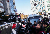 People attend a rally calling for the impeachment of South Korean President Yoon Suk Yeol, in Seoul