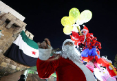 Syrian street vendor dressed as Santa Claus in Damascus