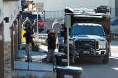 Investigators search a townhouse, in relation to the explosion in Las Vegas of a Tesla Cybertruck