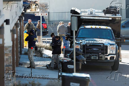 Investigators search a townhouse, in relation to the explosion in Las Vegas of a Tesla Cybertruck