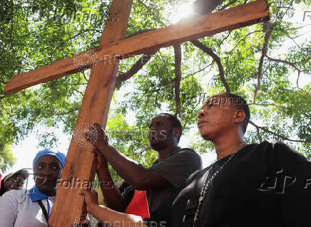 Members of the Roman Catholic commemorate Good Friday during the start of Easter in Harare