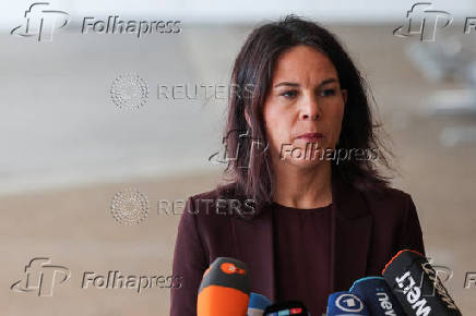 German Foreign Minister Annalena Baerbock delivers a statement at Ben Gurion International Airport in Lod