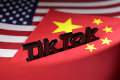 FILE PHOTO: Illustration shows TikTok logo, U.S. and Chinese flags