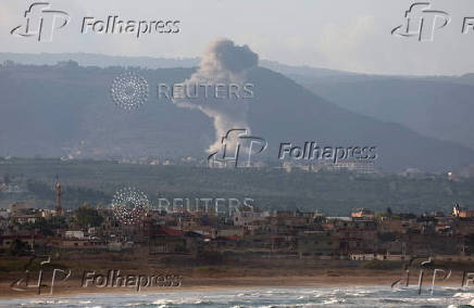 Smoke rises on the Lebanese side of the border with Israel, as seen from Tyre