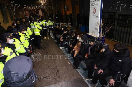 Pro-Yoon protesters participate in a rally outside a court, in Seoul