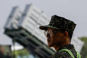 A soldier is seen in front of a Hsiung Feng III mobile missile launcher during Taiwanese President Lai Ching-te?s visit to the base in response to recent Chinese military drills, in Taoyuan