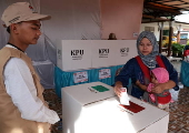 Voters cast their ballows in regional government elections in Indonesia